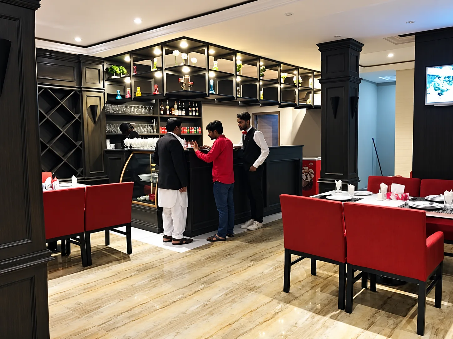 Guests and staff gathering at the restaurant bar